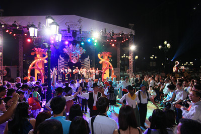 Enthusiastic guests get into the swing of the admission-free Venetian Carnival 2011 at the Outdoor Lagoon, The Venetian Macao